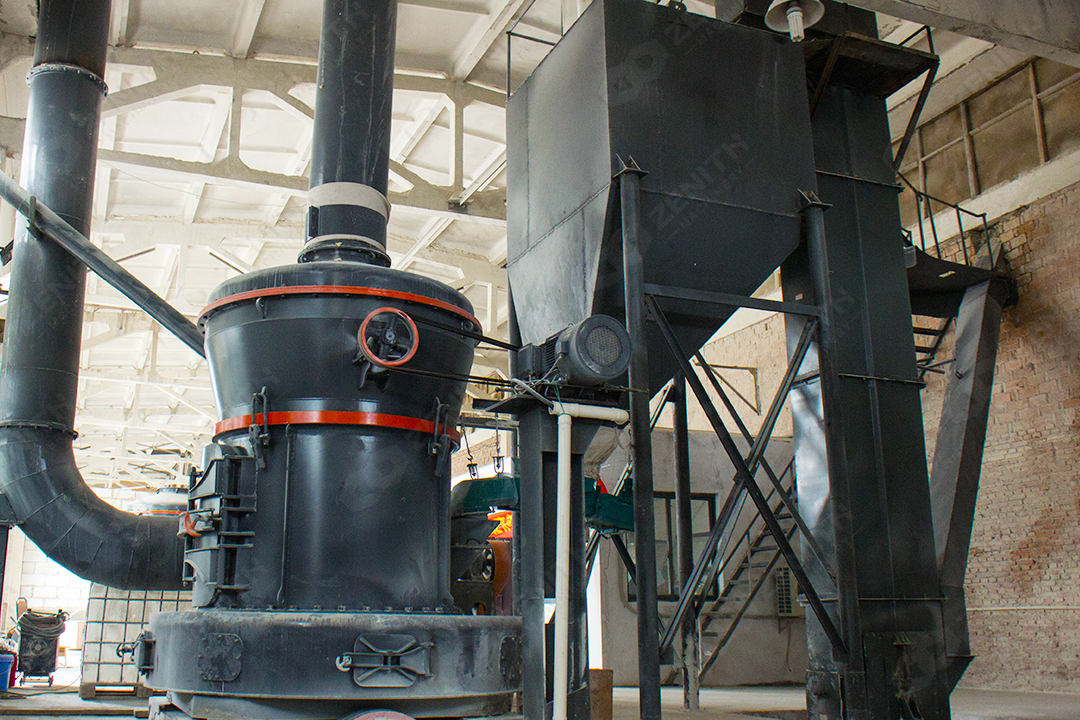 Aerial view of a modern industrial grinding plant with multiple mill installations.
