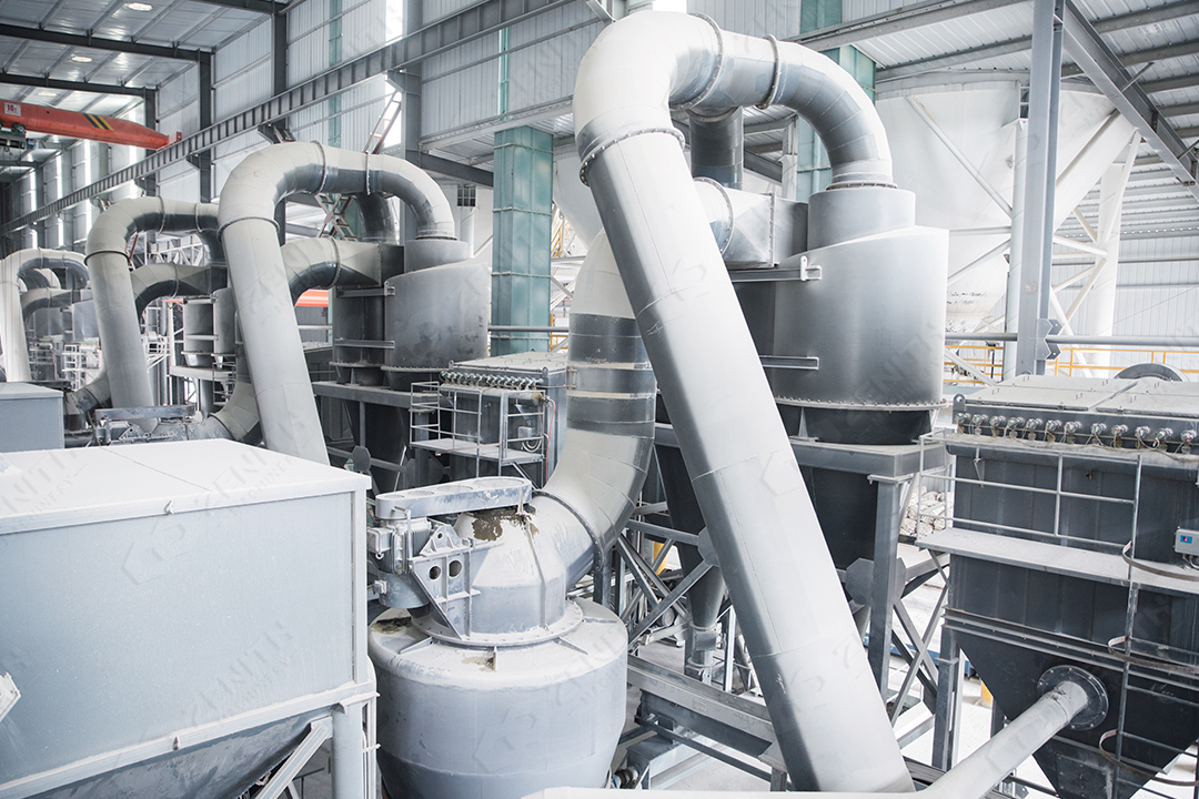 A modern Raymond Mill installation processing mineral ores in an industrial plant.