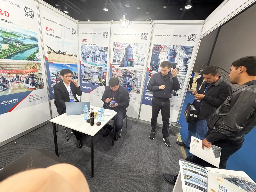 Visitors examining ZENITH machinery at the exhibition
