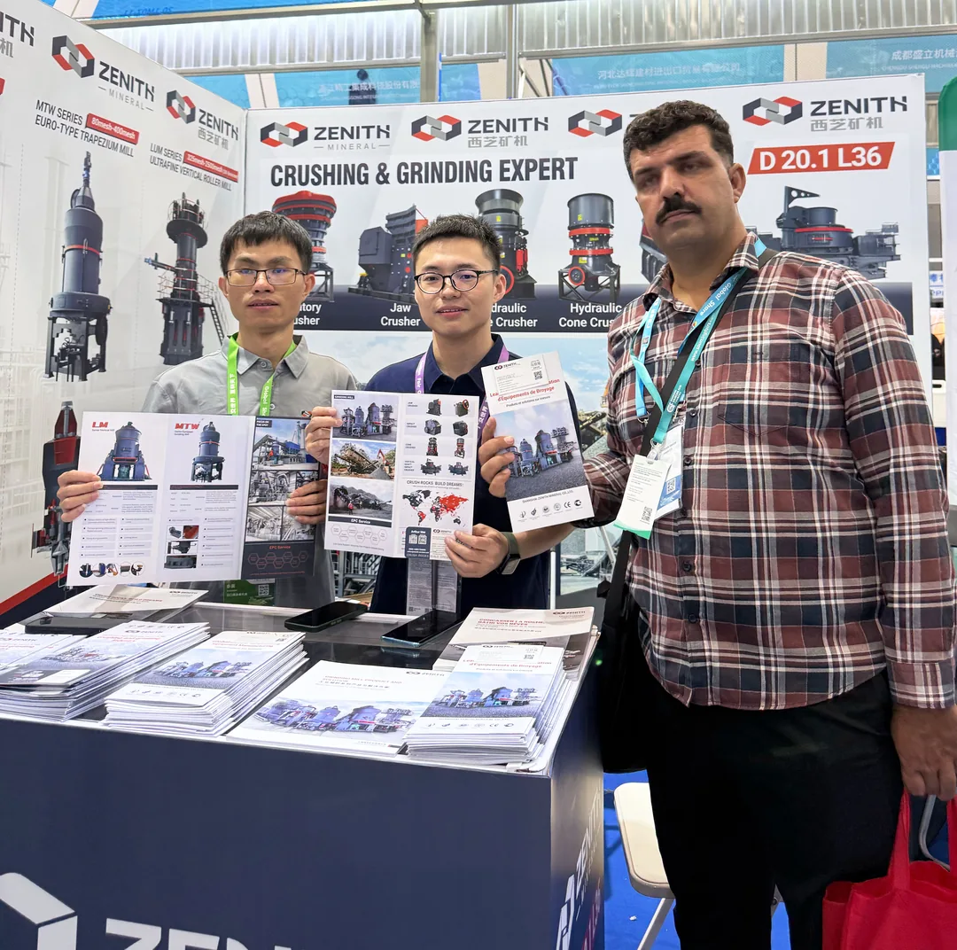 ZENITH staff presenting the product catalogue to a buyer at the booth