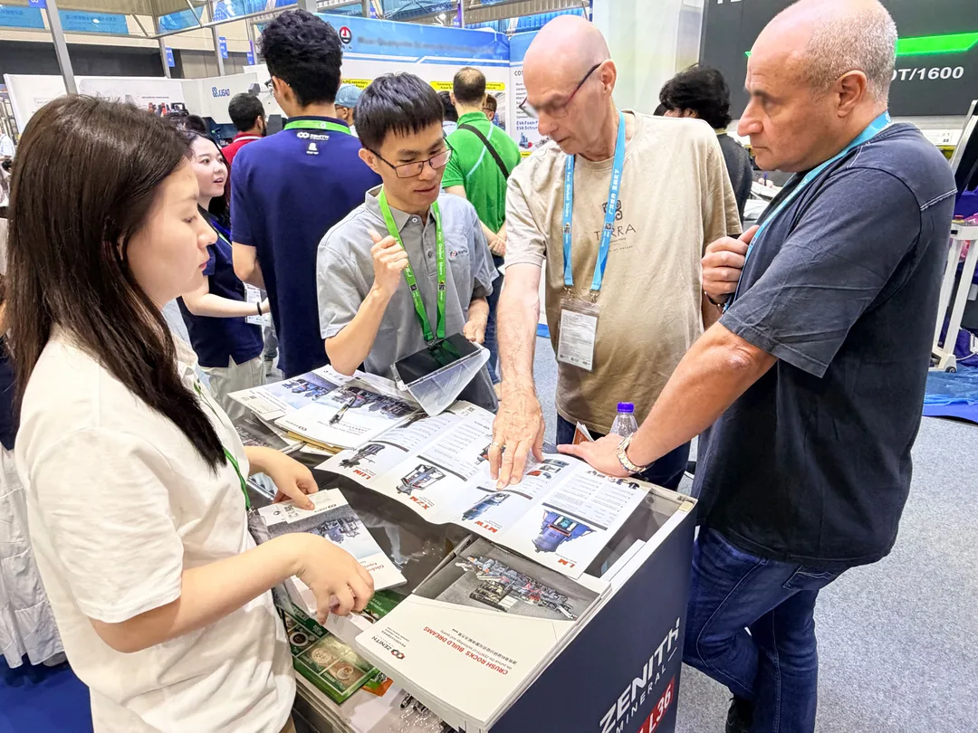 Buyer reviewing ZENITH brochures at the booth counter