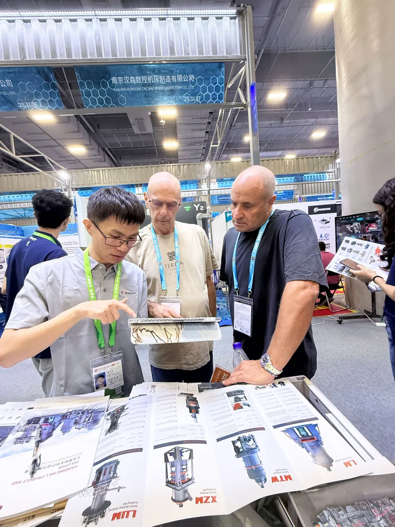 ZENITH engineer pointing out equipment details on a tablet