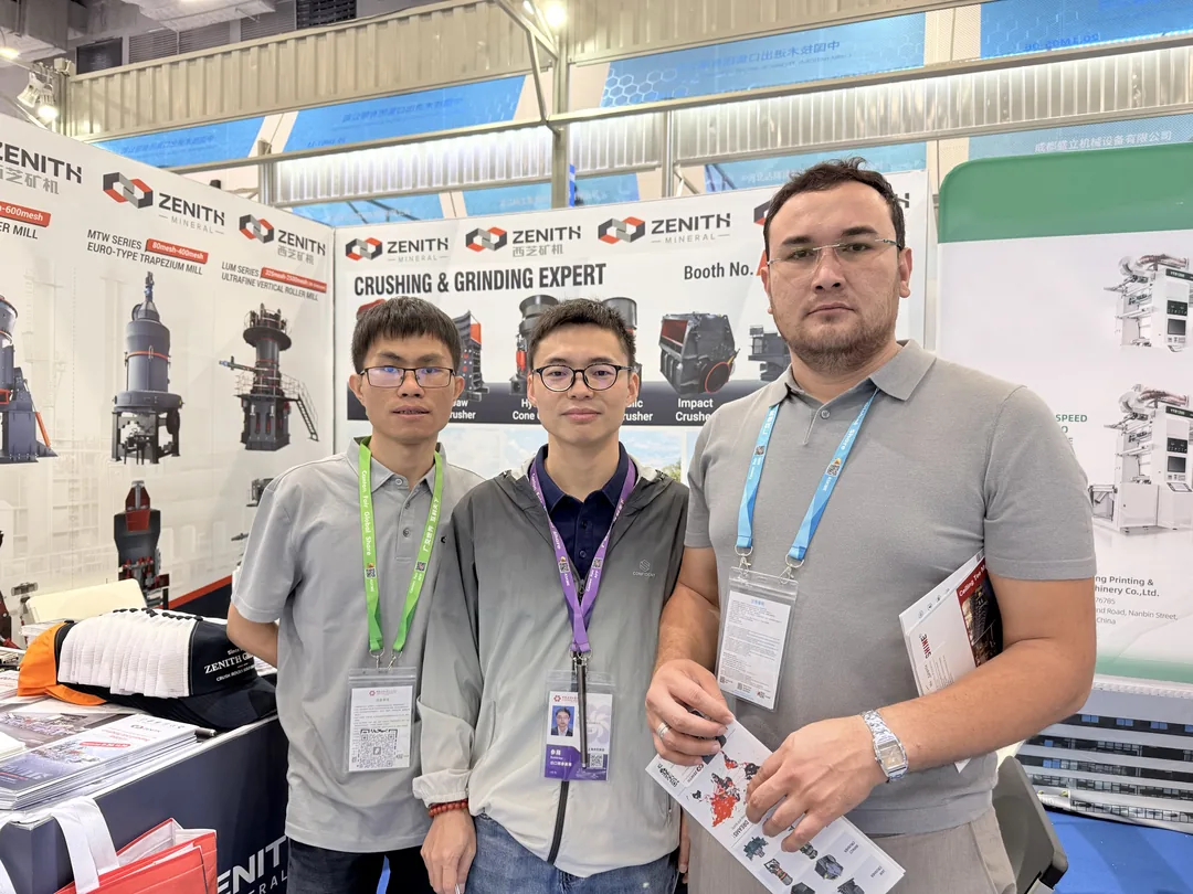ZENITH team photographed with a visitor at the 140th Canton Fair booth