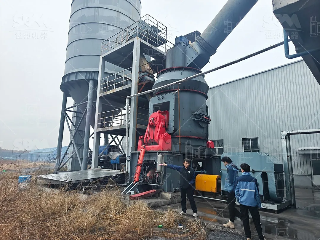 LM vertical roller mill and finished powder silo seen from the plant yard