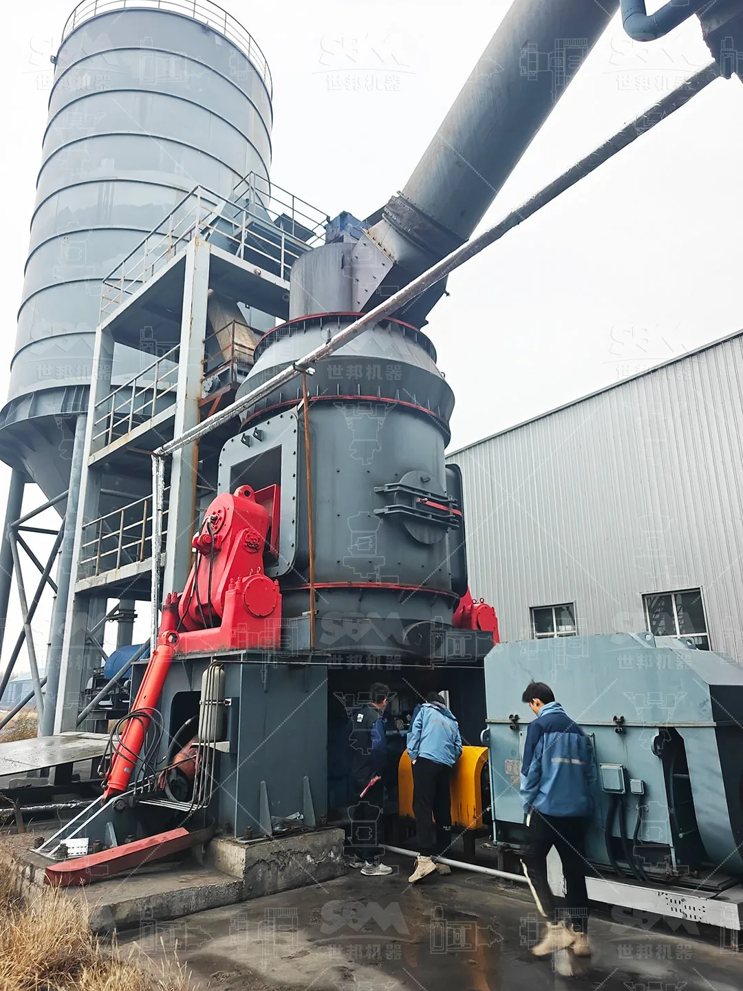 ZENITH engineer and plant staff at the LM vertical roller mill during commissioning