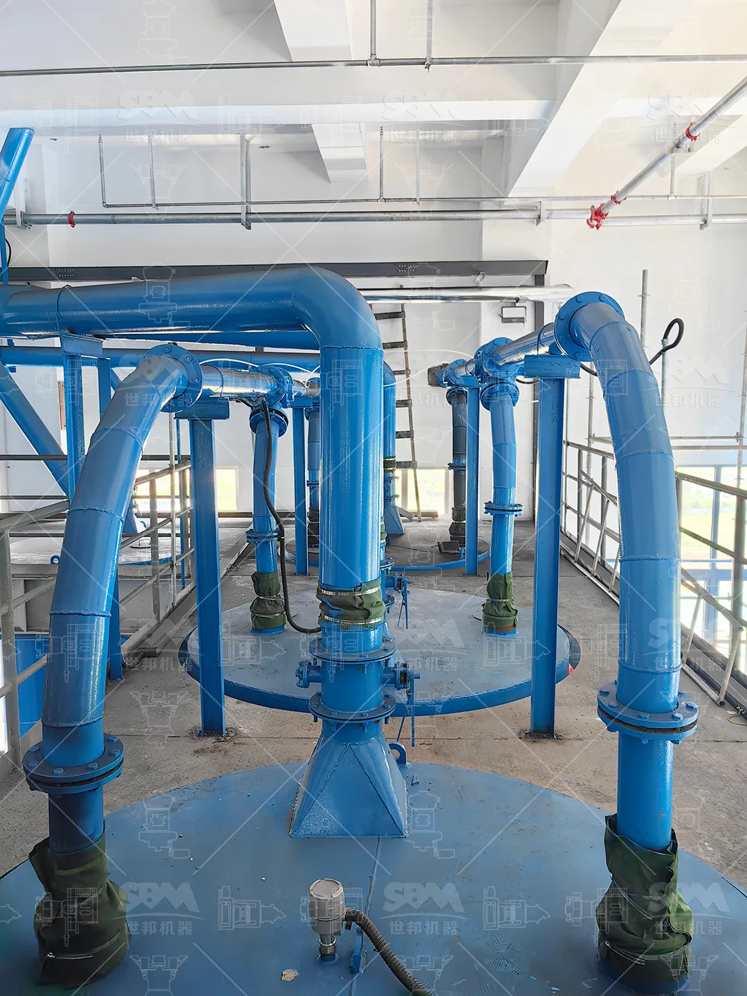 Top outlets of the four MTW178G mills installed in the grinding hall